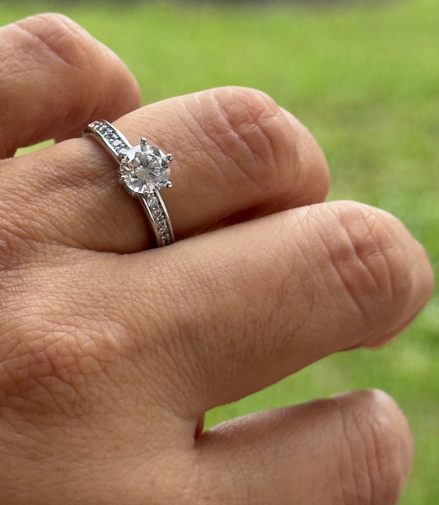 Classic Solitaire Ring With a Pave Band