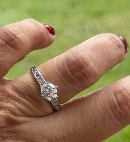 Classic Solitaire Ring With a Pave Band