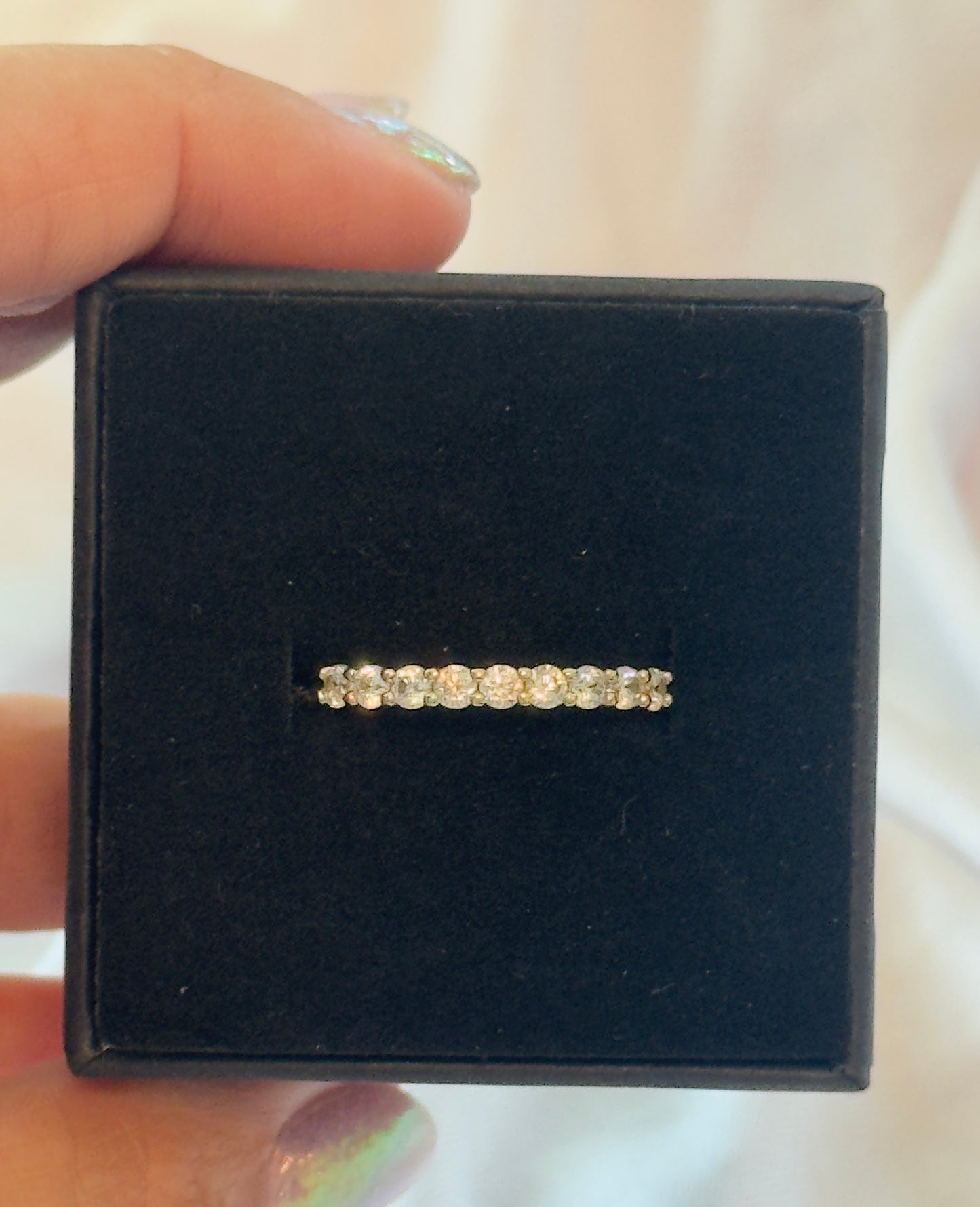 A timeless eternity band featuring sparkling clear stones set in 14KT gold plating. Elegant, stackable, and made for everyday wear.